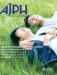 A thumbnail image of the cover for one issue of the American Journal Of Public Health featuring two people lying in the grass and the AJPH acronym prominently in the corner. 